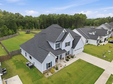 Welcome to 105 Tundra Trail, a beautifully designed 5-bedroom - photo 3