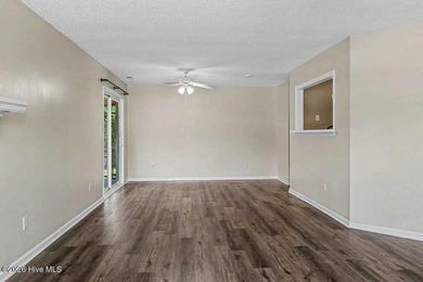 New roof, new LVP (no carpet!), and fresh paint welcome you home - photo 6