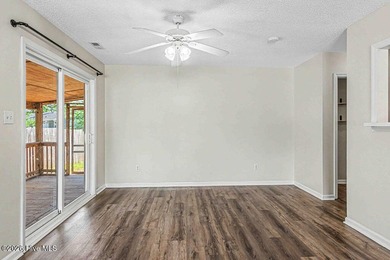 New roof, new LVP (no carpet!), and fresh paint welcome you home - photo 8
