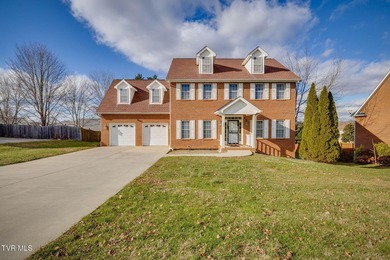 Welcome home to this inviting brick home tucked into the highly - photo 2