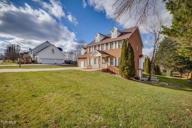 Welcome home to this inviting brick home tucked into the highly - photo 3