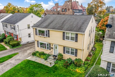 Excellent opportunity to own a well-maintained two-family home - photo 1
