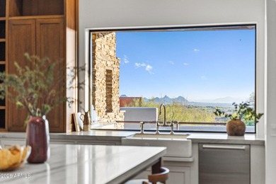Framed by sweeping views of Pinnacle Peak and city lights, this