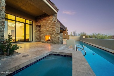 Framed by sweeping views of Pinnacle Peak and city lights, this