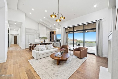 Framed by sweeping views of Pinnacle Peak and city lights, this