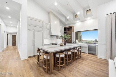 Framed by sweeping views of Pinnacle Peak and city lights, this