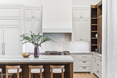 Framed by sweeping views of Pinnacle Peak and city lights, this