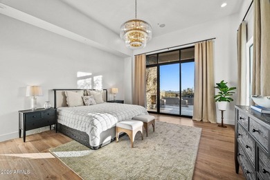 Framed by sweeping views of Pinnacle Peak and city lights, this