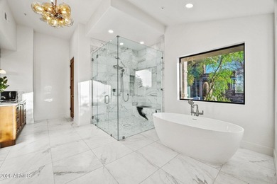 Framed by sweeping views of Pinnacle Peak and city lights, this