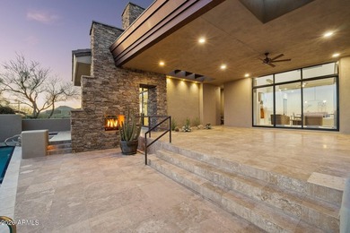Framed by sweeping views of Pinnacle Peak and city lights, this