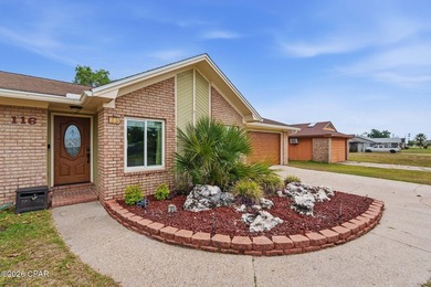 Welcome home to your updated, brick residence nestled in one of - photo 3