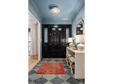 Stunningly renovated in 2024, this 4-bedroom, 3 full bath and 1 - photo 4