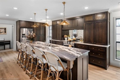 Stunningly renovated in 2024, this 4-bedroom, 3 full bath and 1 - photo 7