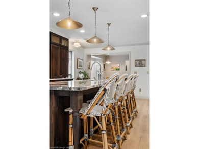 Stunningly renovated in 2024, this 4-bedroom, 3 full bath and 1 - photo 8