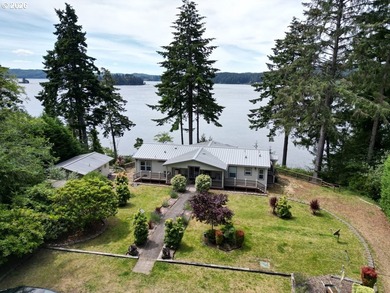 Experience the beauty of lakefront living with this exceptional - photo 1