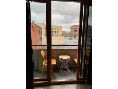 Experience elevated urban living in this refined corner unit