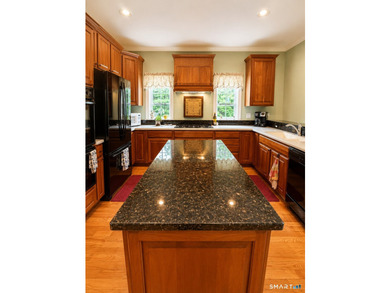 Situated on over an acre of manicured grounds, this custom-built - photo 12