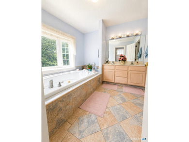 Situated on over an acre of manicured grounds, this custom-built - photo 22