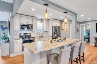 Welcome to 76 Huntington Drive, a beautifully updated 3-bedroom - photo 9