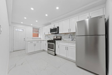 This exceptional legal two-family home offers the ideal - photo 5