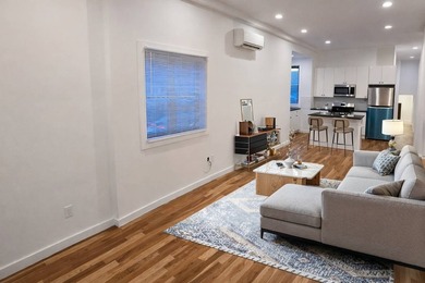 Introducing a fully renovated two-family residence situated on a - photo 4