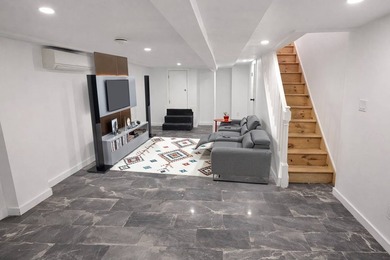 Introducing a fully renovated two-family residence situated on a - photo 9