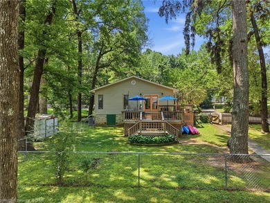 Tucked away along the shoreline of Lake Hamilton in a peaceful - photo 1