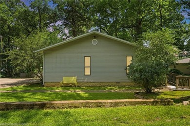 Tucked away along the shoreline of Lake Hamilton in a peaceful - photo 3