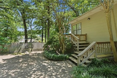 Tucked away along the shoreline of Lake Hamilton in a peaceful - photo 5