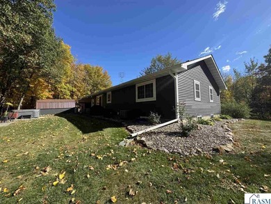 Country living on 2 1/2 acres awaits you with this updated 4