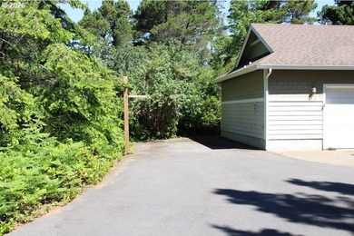 Nestled in a peaceful wooded setting within the desirable Heceta - photo 3