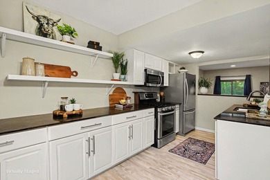 Welcome to this beautifully maintained end-unit townhome in a - photo 5
