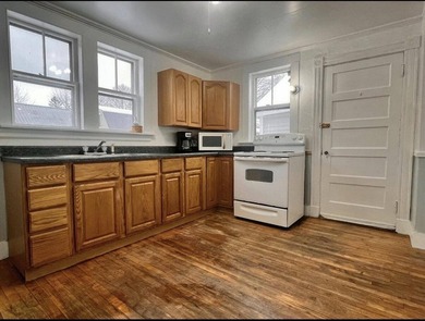 Step into this cozy 2-bedroom, 1.5-bath New Englander, where - photo 3