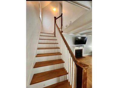 Step into this cozy 2-bedroom, 1.5-bath New Englander, where - photo 6