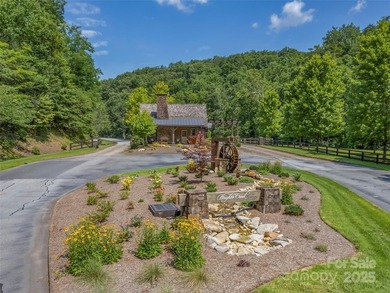 Private .97 acre lot with a stream in the highly desirable gated - photo 1
