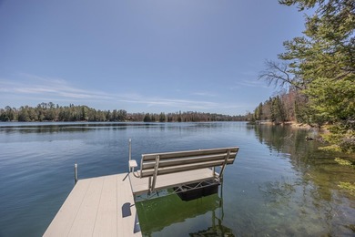 Set on 219' of shoreline along the striking blue-green waters of - photo 12