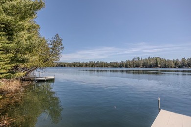 Set on 219' of shoreline along the striking blue-green waters of - photo 13