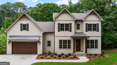 NEW CONSTRUCTION...Lakefront and nestled among the trees - photo 1