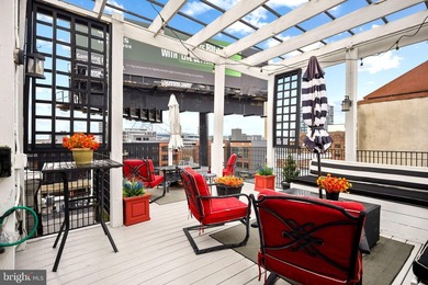 This beautifully updated penthouse offers a unique blend of - photo 15
