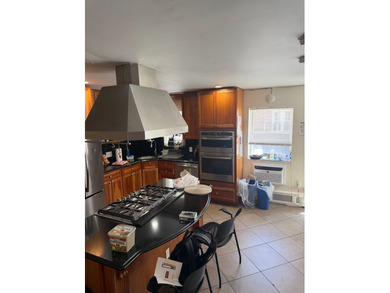 Introducing a beautifully maintained two-family home situated in - photo 6