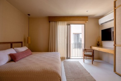 Tucked away in the lush embrace of Aldea Zama, Aflora is more - photo 11