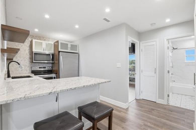 Welcome to this beautifully renovated corner-unit condo in the - photo 10