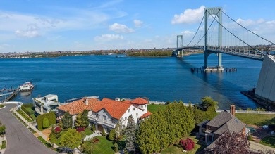 Set on a half-acre with 128 feet of direct waterfront, this 6 - photo 1
