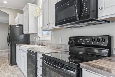 Welcome to Market Village! This welcoming 3-bedroom, 2-bath - photo 13