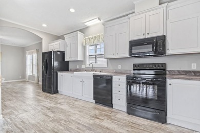Welcome to Market Village! This welcoming 3-bedroom, 2-bath - photo 14