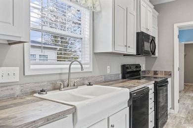 Welcome to Market Village! This welcoming 3-bedroom, 2-bath - photo 15