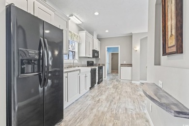 Welcome to Market Village! This welcoming 3-bedroom, 2-bath - photo 16