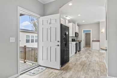 Welcome to Market Village! This welcoming 3-bedroom, 2-bath - photo 24