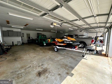 LAKE FRONT, HUGE 8 CAR GARAGE, POOL, DEEP WATER DOCK WITH LIFT - photo 37