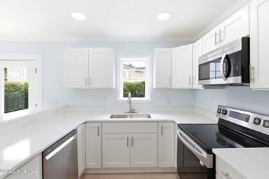 Beautifully updated and move-in ready, this 4-bedroom, 2.5-bath - photo 11